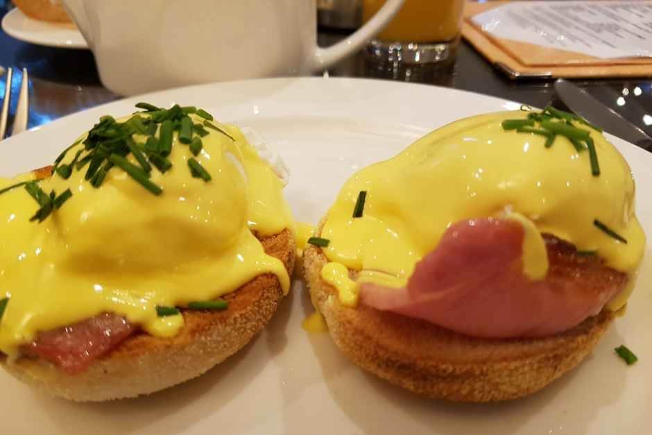 Salmon Eggs Benedict American breakfast featuring Eggs Benedict, breakfast omelets and waffles