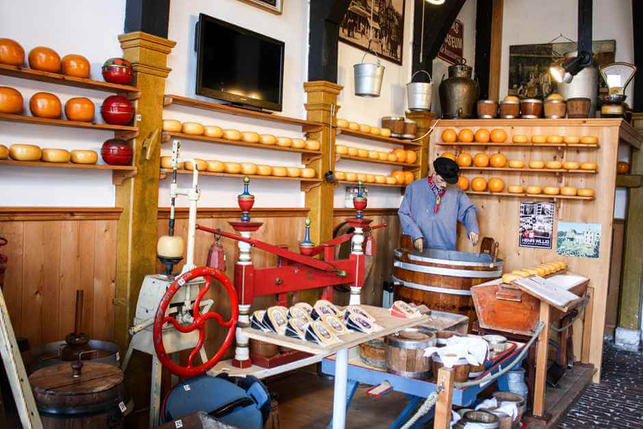 Today a doll is touching the cheese at the cheese market in Edam - edam holland sights