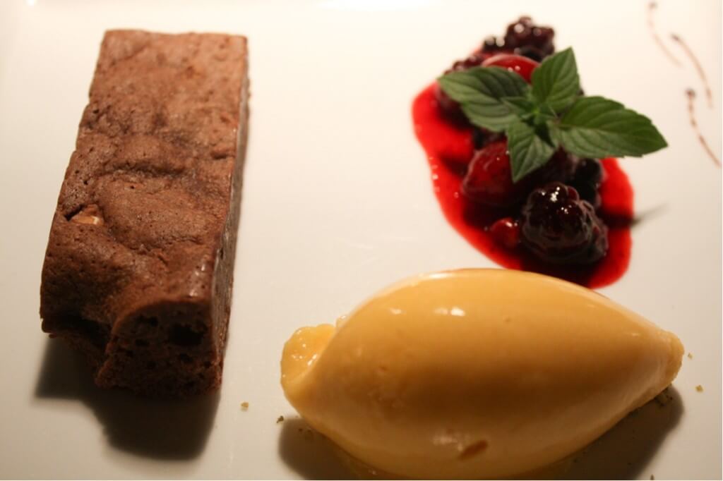 Chocolate brownie with berries and sorbet
