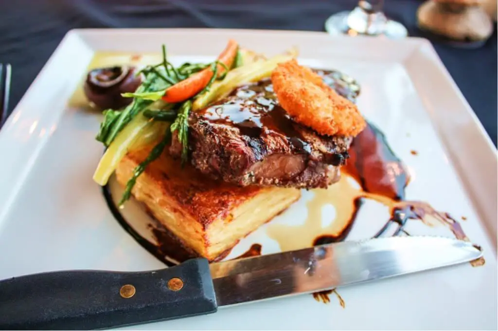 Steak with potato gratin and fried mushrooms