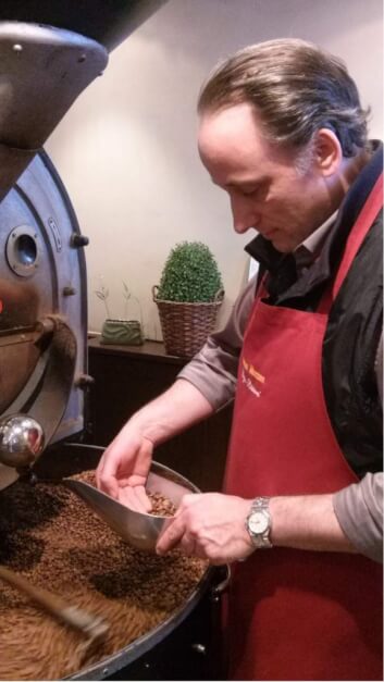 Peter Maaßen checks the freshly roasted coffee