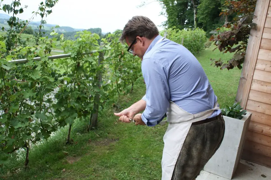 Rainer Ogrinigg carefully opens the champagne bottle