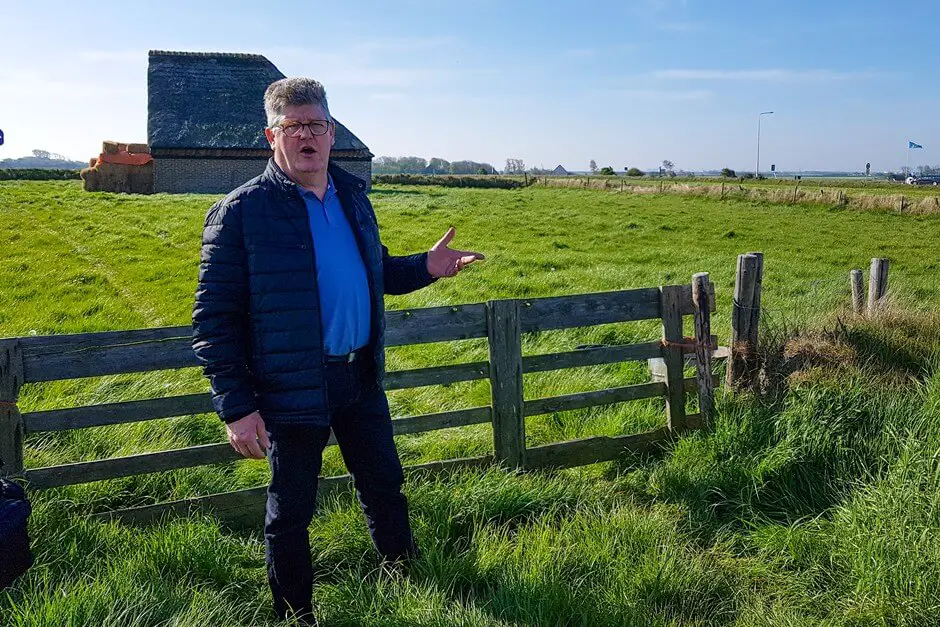 Arnold in front of a sheep barn