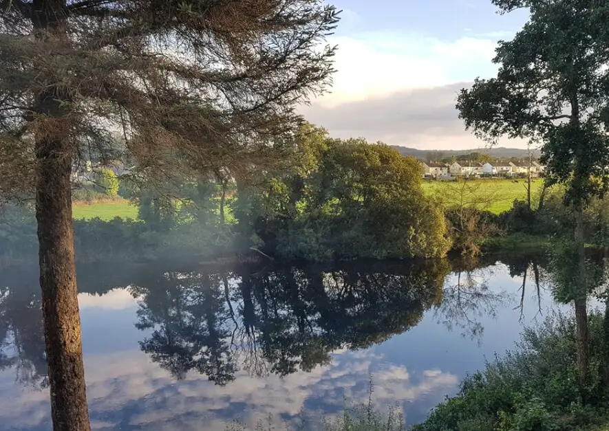 Mist veil over the Flesk River in Killarney, Ireland