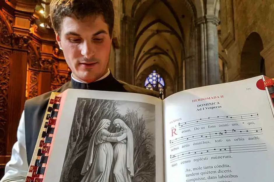 Brother Isaak Maria shows the reading book in Heiligenkreuz Abbey