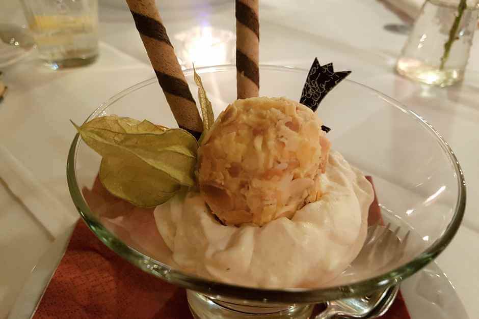 Vanilla ice cream in almond coating on eggnog cream
