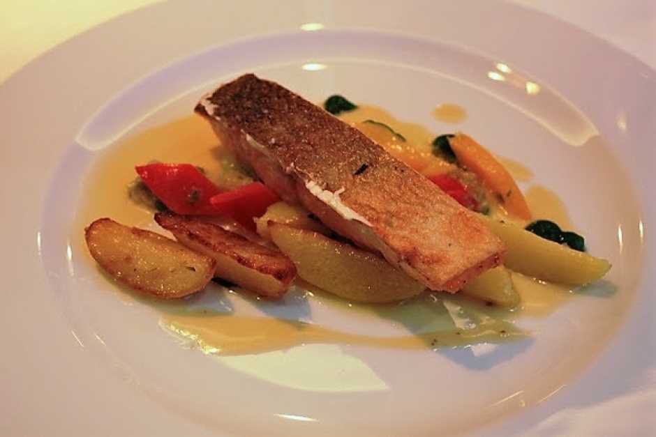 Salmon fillet on vegetables and potatoes at the Falkensteiner Hotel Schladming