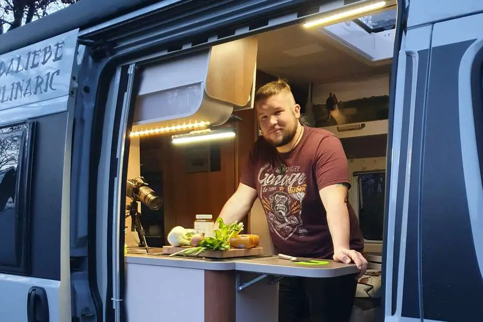 Chris in his camper kitchen