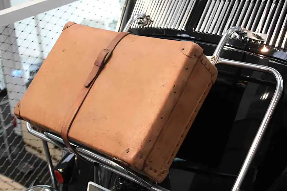 Suitcases were strapped to the rear of the beetle