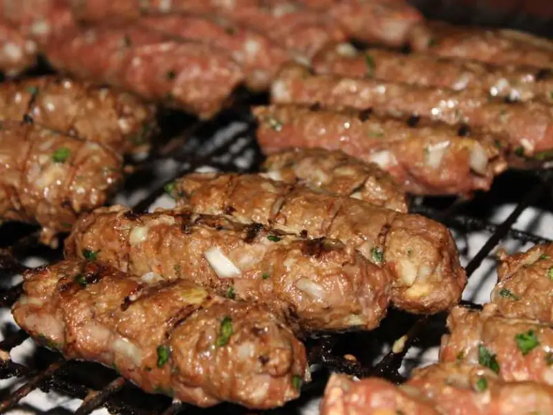 Grilling cevapcici on the gas grill
